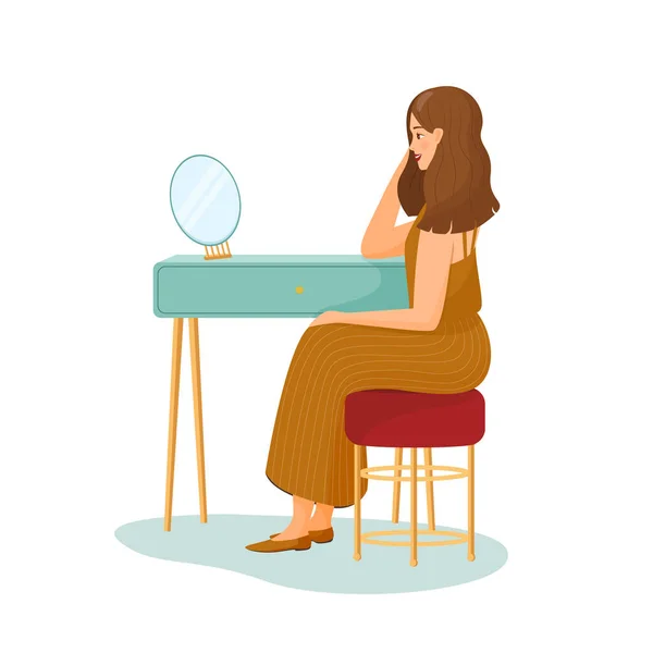 Jovem mulher senta-se à mesa de vestir e olha no espelho. Menina de saia listrada. Ilustração vetorial sobre fundo branco. cabelo a escorregar. Rotina matinal, começar o dia, a vida quotidiana. Desenhos animados planos —  Vetores de Stock