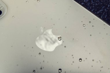 Kyiv, Ukraine 06.13.2021 - Close-up gold Iphone 12 pro max on the dark background