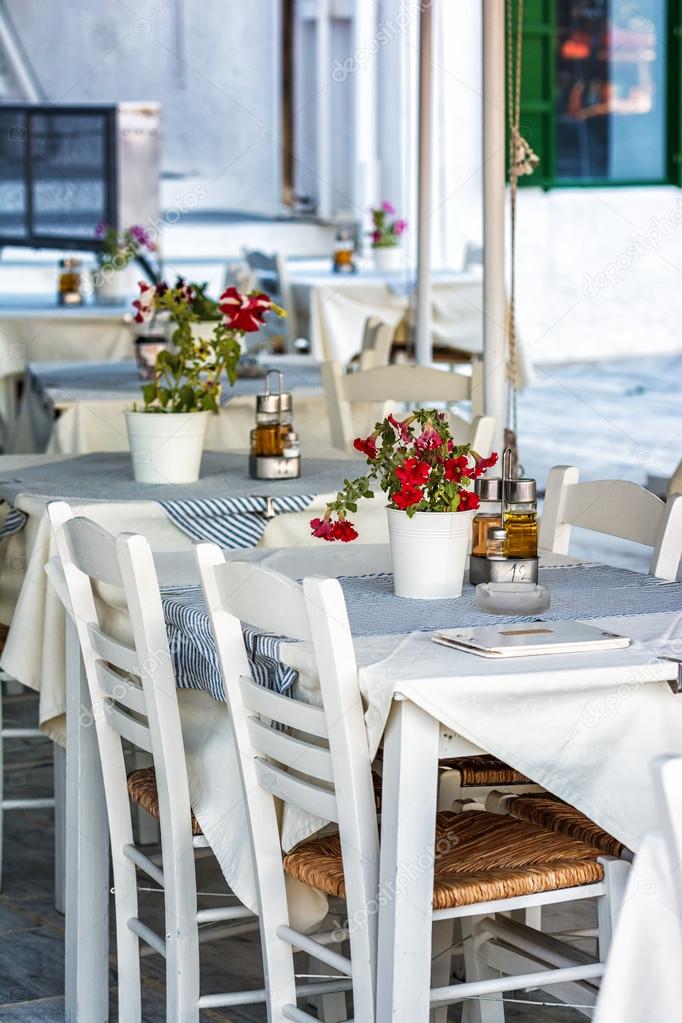 Traditional greek taverna in the streets of Milos in Greece