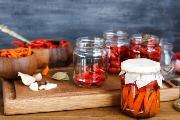 Dried tomatoes in glass jars — Stock Photo, Image
