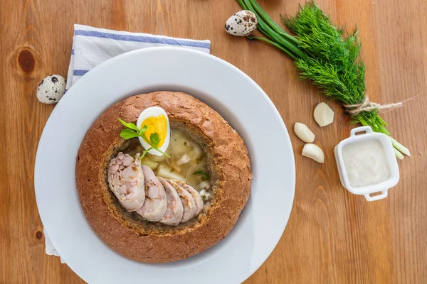 Traditional polish zurek with sausage, egg in bread — Stock Image Traditional polish zurek with sausage, egg in bread Royalty Free Stock Images