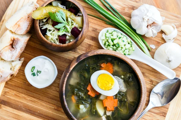 Delicious green soup with sorrel on table close-up — Stock Image Delicious green soup with sorrel on table close-up Stock Picture