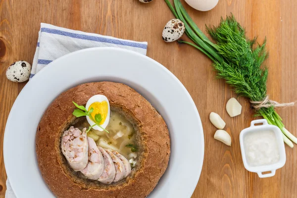 Polish rye soup with eggs and sausage in bread — Stock Image Polish rye soup with eggs and sausage in bread Royalty Free Stock Images
