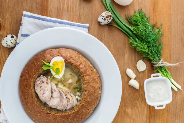 Polish rye soup with eggs and sausage in bread — Stock Image Polish rye soup with eggs and sausage in bread Royalty Free Stock Photos