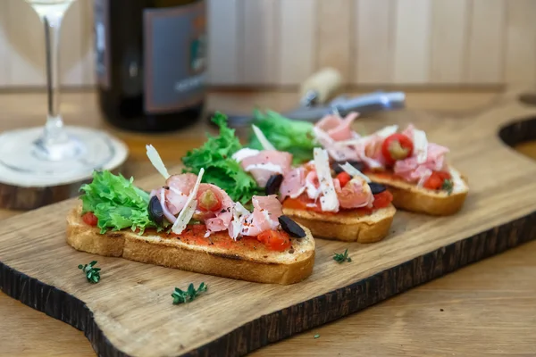 Tapas with Crusty Bread - Selection of Spanish tapas served on baguette. — Stock Photo, Image