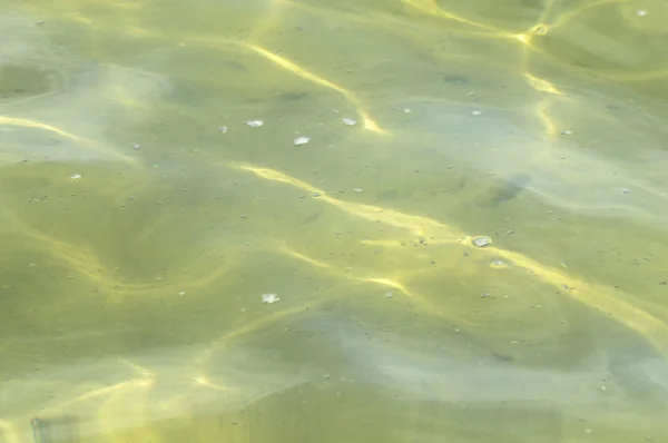 Sluneční paprsky písek vody — Stock fotografie