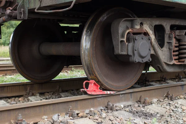 Heavy iron wheels  of wagon on a railway track.