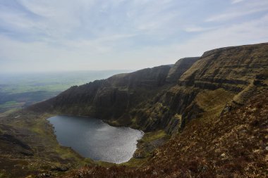 horizontal landscape of mountains from a very high point where you can see a large lake. Comeragh Mountains, Waterford, Ireland.