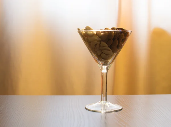 Almonds and cashew in martini glass — Stock Photo, Image