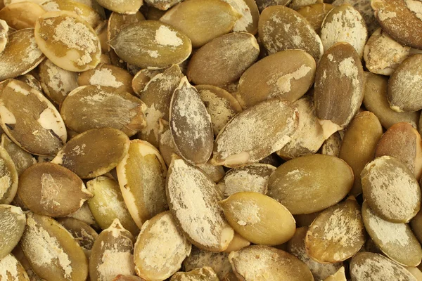Food background - shelled  pumpkin seeds — Stock Photo, Image
