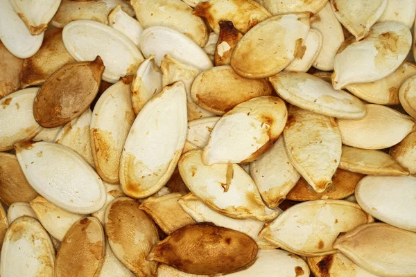 Food background - big unshelled  roasted pumpkin seeds — Stock Photo, Image