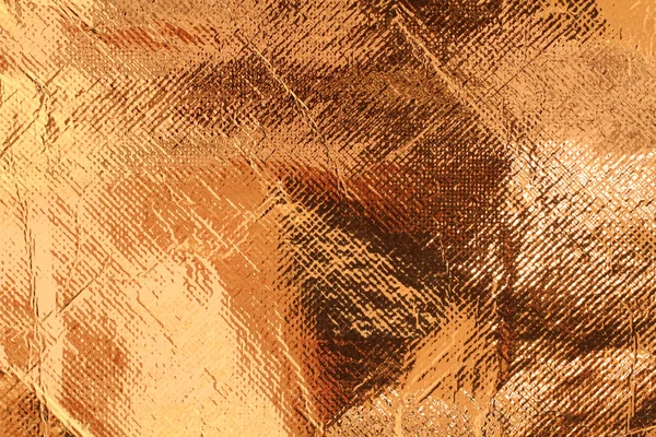 Bronzová barva fólie textura připojené s tkaninou — Stock fotografie zdarma