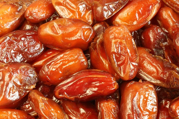 Dried dates situated arbitrarily. Food background — Stock Photo, Image