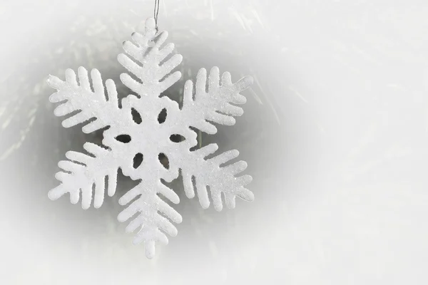 Decoration on Christmas tree - toy white snowflake on fir-tree — Stock Photo, Image