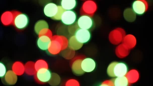 Defocused colorful lights flickering on black background — Stock Video