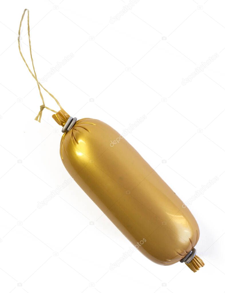 Sausage in golden plastic wrapper, close up, isolated on white background
