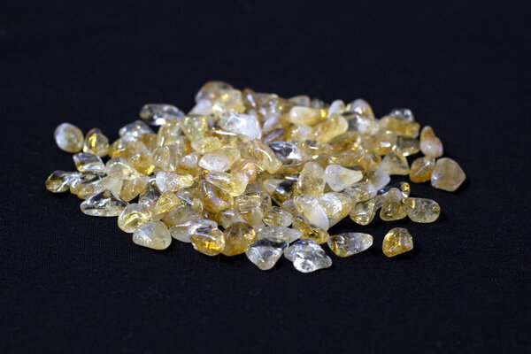 Citrine yellow gem geode crystals geological mineral on black background close up