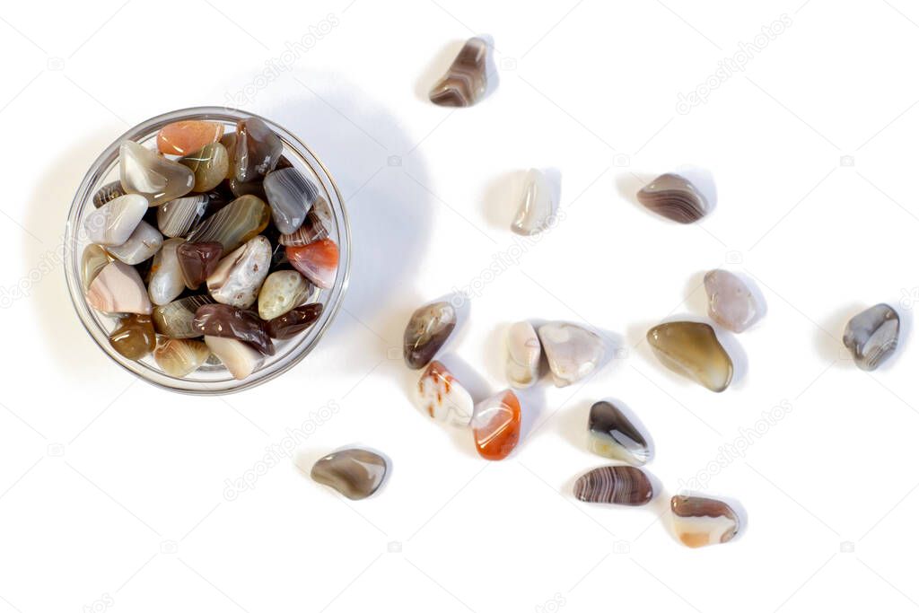 Natural Agate in small bowl, various types and color, gems mineral collection isolated on white background
