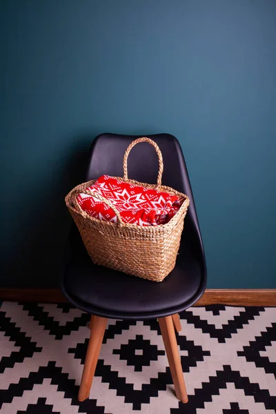 armchair with Christmas basket and sweater, gifts, holiday, New Year similar