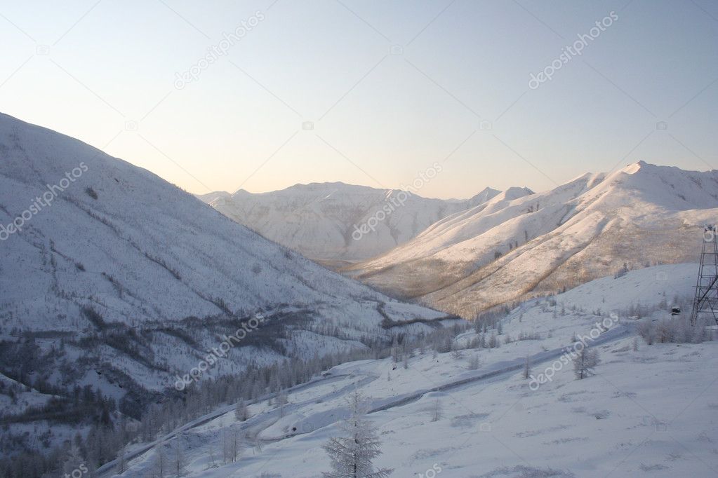 Winter mountain landscape in Yakutia. Snow-covered hills and low mountains.