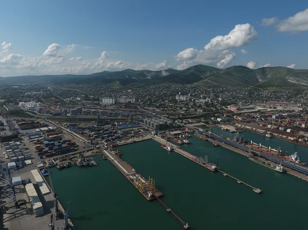 Industrial seaport, top view. Port cranes and cargo ships and barges. — Stock Photo, Image