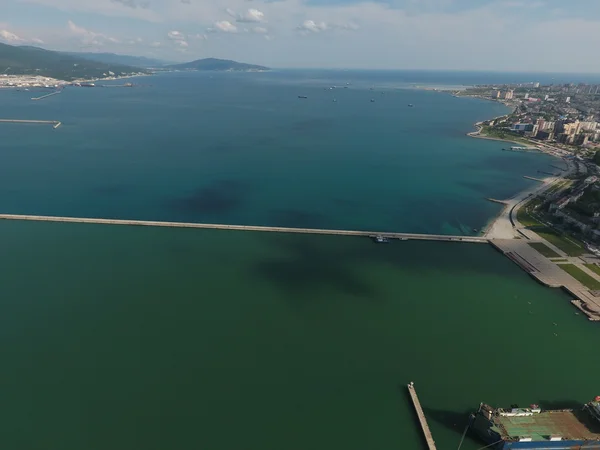 Top view of the bay Tsemess. The international sea port of Novorossiysk. Mol - building to stop the waves.