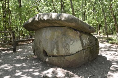 Big Shapsug dolmen. A megalytic construction in the woods of Kuban. clipart