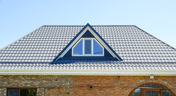 The roof of corrugated sheet. Roofing of metal profile wavy shape.