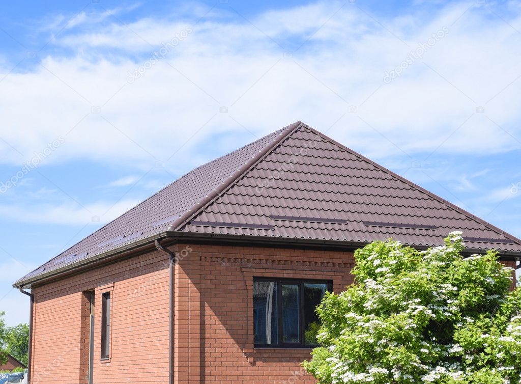 The roof of corrugated sheet. Roofing of metal profile wavy shape.