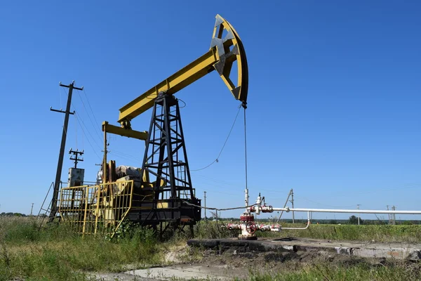 The pumping unit as the oil pump installed on a well Stock Image