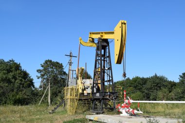 Pumping unit as the oil pump installed on a well clipart