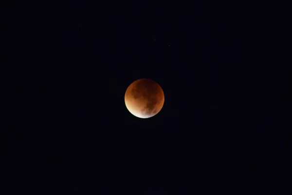 Total lunar eclipse. Orange Moon during an eclipse.