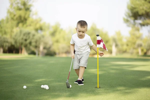 Little Boy Playing Golf Hitting Ball Putter Green Grass — Stock Photo, Image