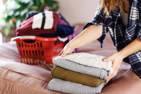 Woman Hands Folding Clothes Bedroom Taking Red Laundry Box — Zdjęcie stockowe