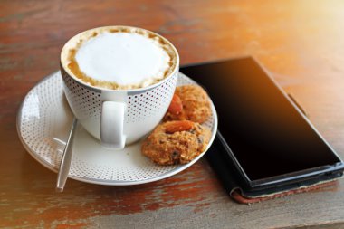 Kahve fincan kapuçino ve Tay çerez .effect vintage tarzı