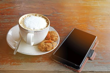 Kahve fincan kapuçino ve Tay çerez .effect vintage tarzı