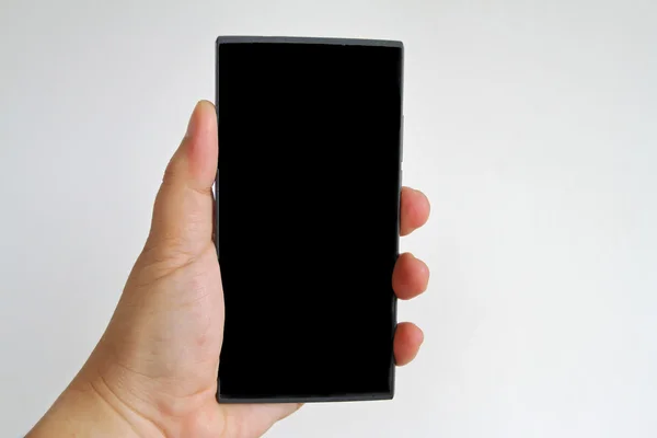 Kézben tartása okos telefon elszigetelt fehér háttér — Stock Fotó