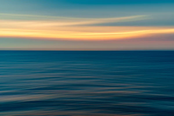 Hintergrund des Meeres und Sonnenuntergangs verschwimmen — Stockfoto