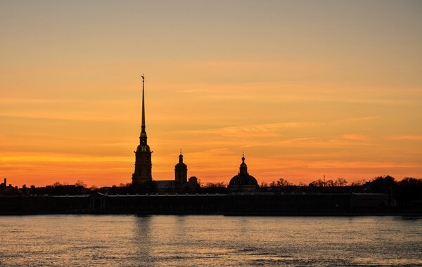 White nights, summer and the beautiful sunsets over the river Neva and the Peter and Paul fortress in St. Petersburg.