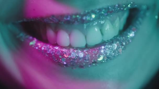 Portrait of Young Woman Looking at Camera in Colourful Filter. Happy Smile on Face of Charming Girl. Fashion of Caucasian Lady in Ultra-Violet of Night Club. Iridescent Multi-Colours in Neon Lighting — Stock Video
