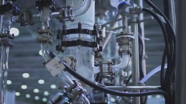 Water pump and pipes. Transparent pipe to show water flows inside the water supply system — Stock Footage Water pump and pipes. Transparent pipe to show water flows inside the water supply system Video Clip