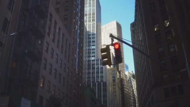 Yellow Hanged Traffic Light in New York. Crossing roads in tourist places. Financial district of the city. Red and green lights. — Stock Video