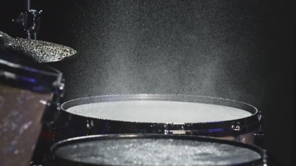 The drummer hits the wet drum cymbal with his drumstick and the water splashes in slow motion. In the recording studio of musical instruments — Stock Video