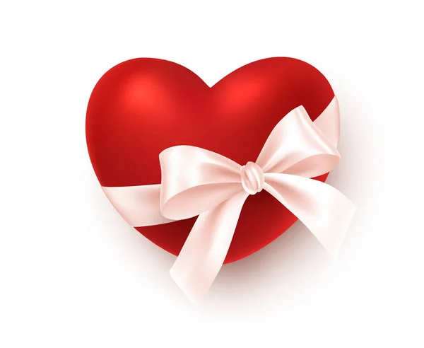 Realisztikus vörös szív fehér selyem szalaggal íj elszigetelt fehér háttérrel. Ünnepi design elem Boldog Valentin napi üdvözletét. Vektorillusztráció — Stock Vector