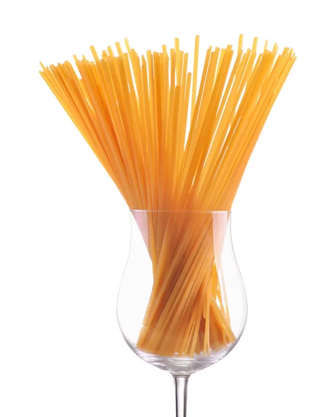 Pasta spaghetti nudlar i glas isolerade på vit bakgrund Stockbild