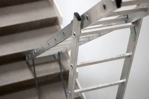 Metal stepladder on stairs — Stock Photo, Image