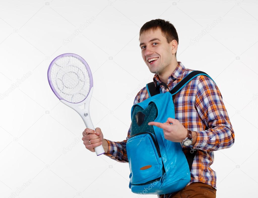 man with a racket against mosquitoes