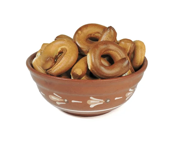 Klei kom, een bord, een bowl, bagels, pretzels, isoleren, witte achtergrond Rechtenvrije Stockfoto's