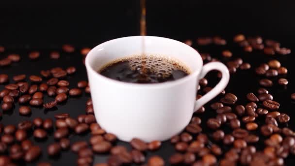 Coffee Flowing White Cup Roasted Beans Black Background — Stock Video