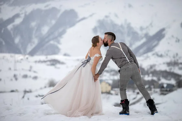 Groom Suit Bride Dress Hold Hands Kiss Winter Ski Resort Stock Photo